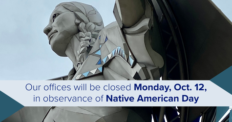 Statue of Dignity with banner: Our offices will be closed Monday, Oct. 12, in observance of Native American Day.